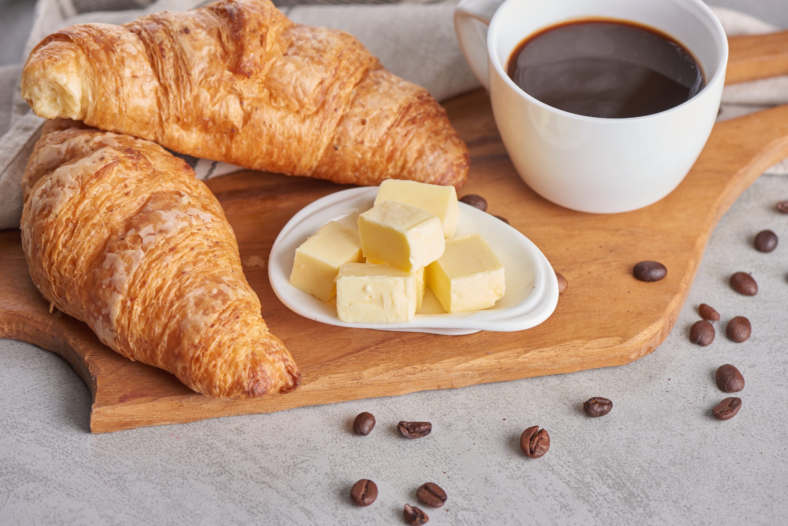 Delicious breakfast with fresh croissants and coffee served with